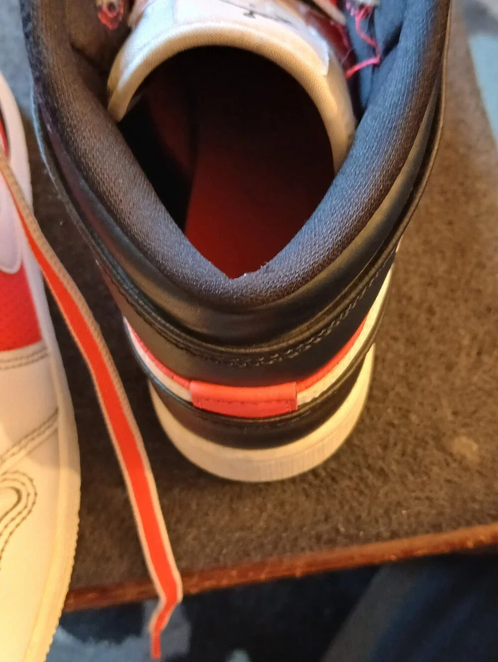 Nike Kids White and Orange High-Top Sneakers with Black Accents